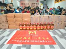 從豬圈屋走出的愛心使者-謝武杰冒雨助殘，傳承雷鋒精神